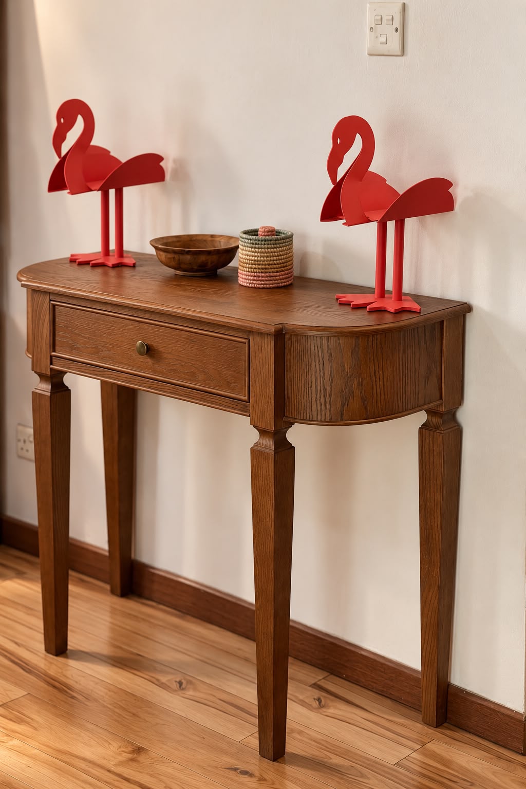 Opposite angle of the console with red flamingo ornaments